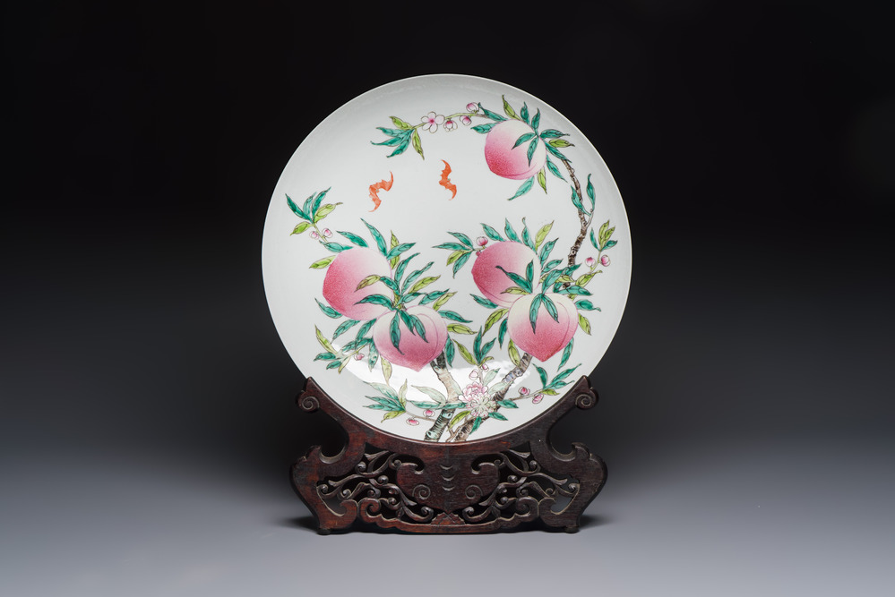 A Chinese famille rose 'Nine Peaches' dish on wooden stand, Yongzheng mark, 20th C.