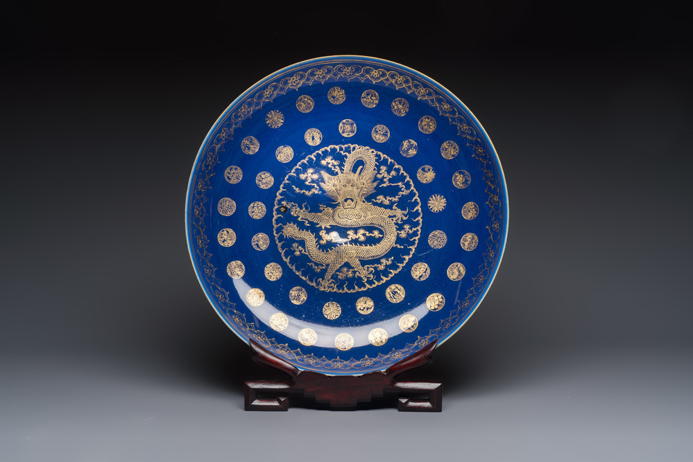 A large Chinese gilt-decorated powder-blue-ground 'Dragon' dish on a later wooden stand, Guangxu mark and of the period