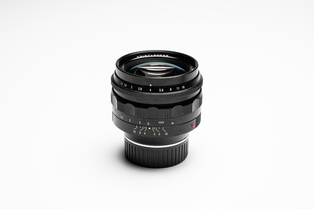 A Voigtl&auml;nder Nokton 50 mm F1.1 lens and hood