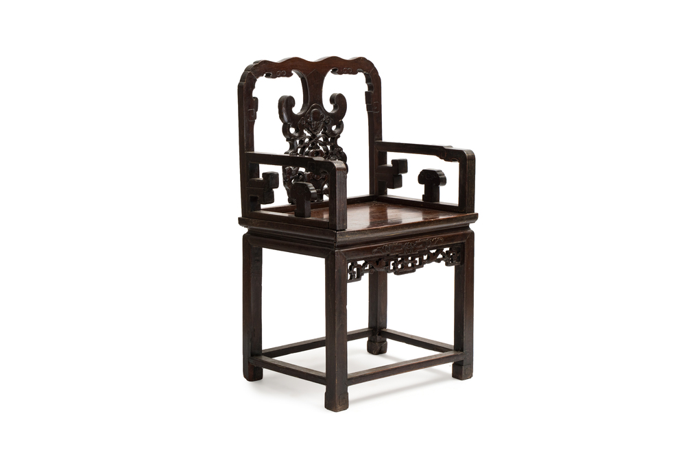 A Chinese carved hongmu armchair, 19th C.