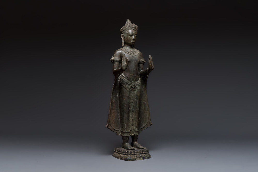 A large bronze Lopburi-style standing Buddha Shakyamuni, Thailand or Cambodia, 20th C.