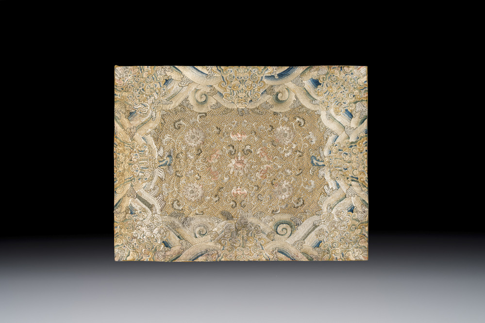 A Chinese cream-ground embroidered silk panel with bats, floral scrolls, waves and rockwork, 19th C.