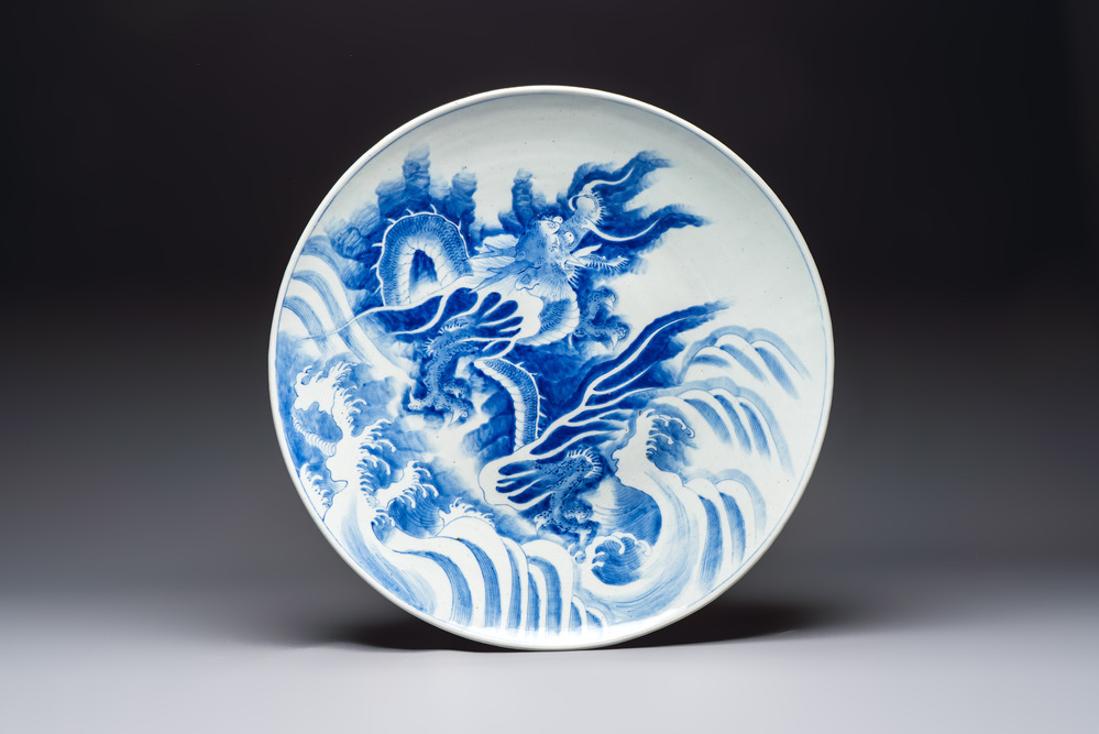 A massive Japanese blue and white 'Dragon among Sea Waves' dish, probably Arita, Meiji, 19th C.