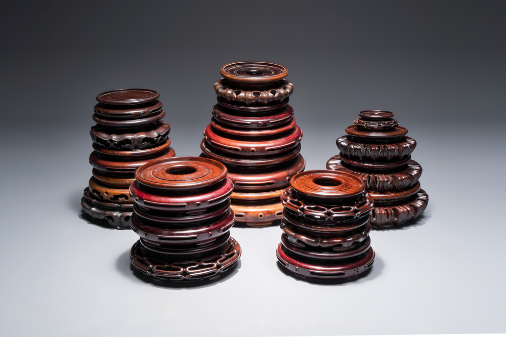 A collection of 20 Chinese wooden stands, 19/20th C.