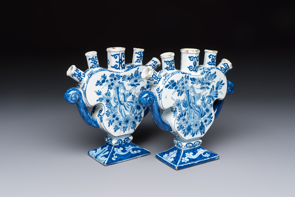 A pair of blue and white Dutch Delft tulip vases with a lady holding a cornucopia, 19th C.