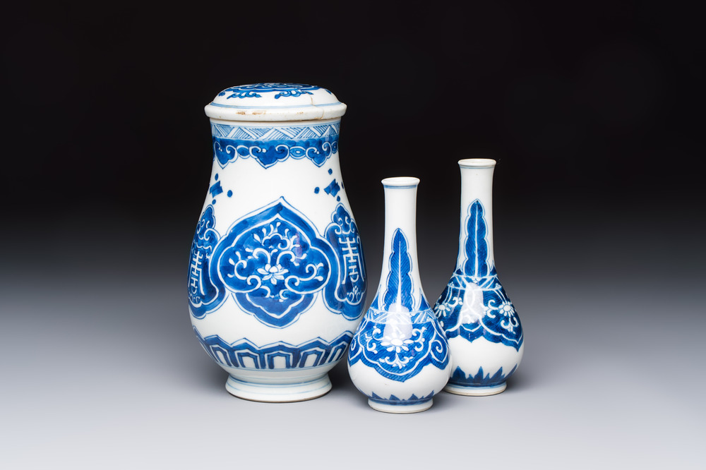 A Chinese blue and white covered vase and two bottle vases, Chenghua and jade marks, Kangxi