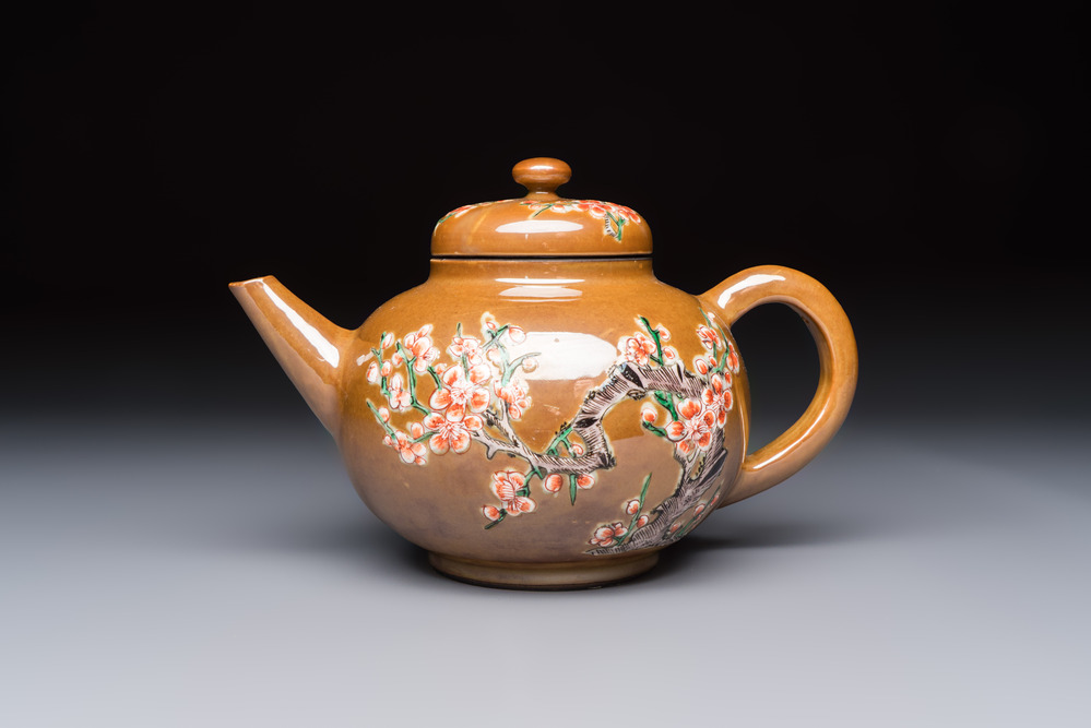 A large Chinese famille verte capucin-ground 'Prunus Blossoms' teapot and cover with relief design, Kangxi