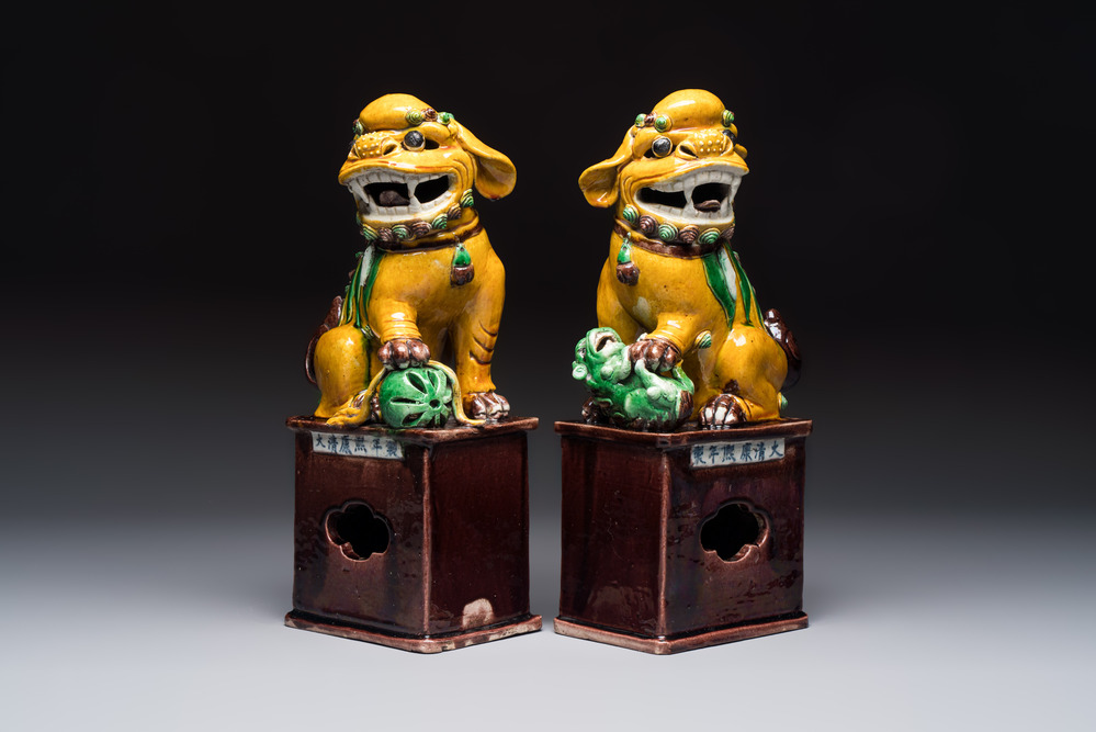A pair of Chinese sancai-glazed Buddhist lions, Kangxi mark, 19th C.