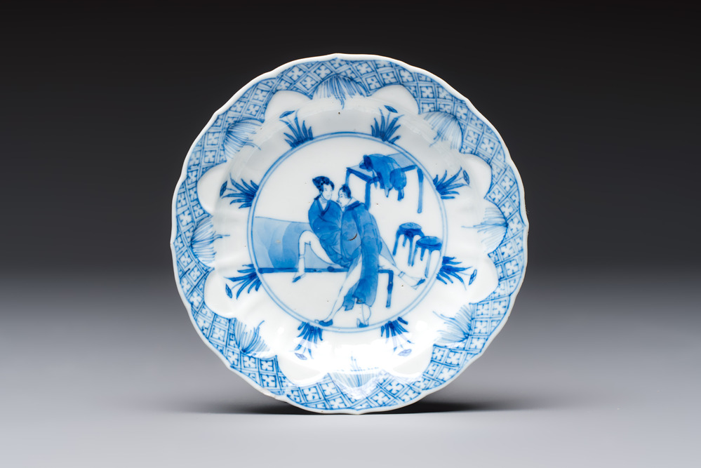 A Chinese blue and white 'Erotic Subject' saucer, Chenghua mark, Kangxi