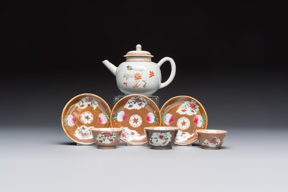 A Chinese famille verte teapot and three famille rose capucine-ground cups and saucers, Kangxi/Qianlong