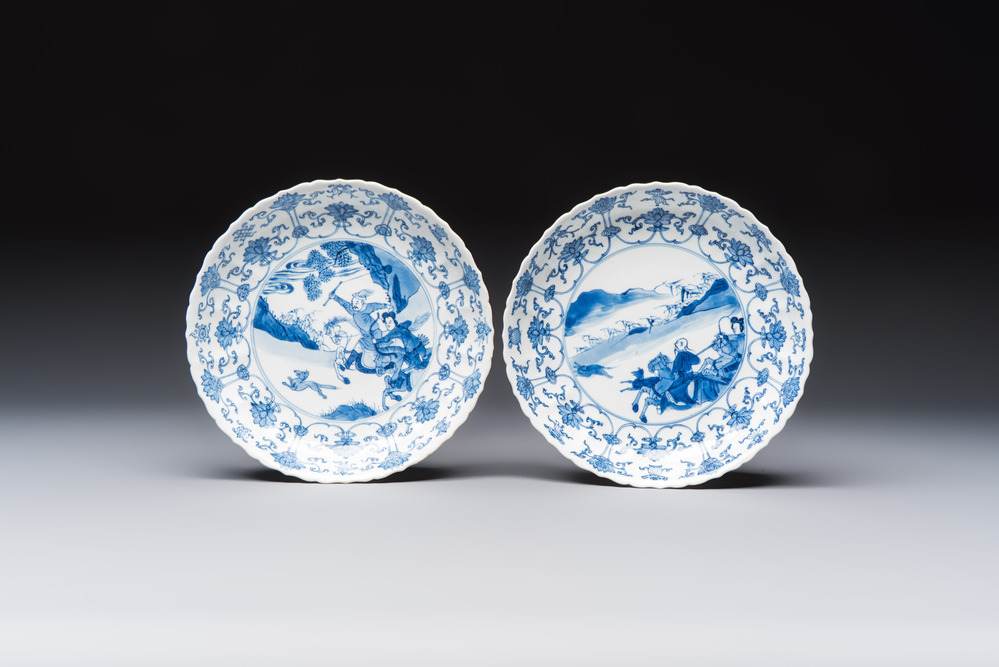 A pair of Chinese blue and white 'Hunting' plates, Chenghua marks, Kangxi