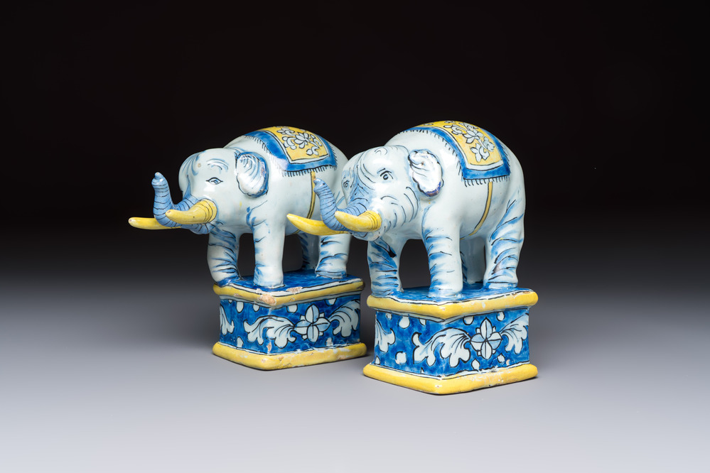 A pair of blue, white and yellow Frankfurt faience models of elephants, ca. 1700