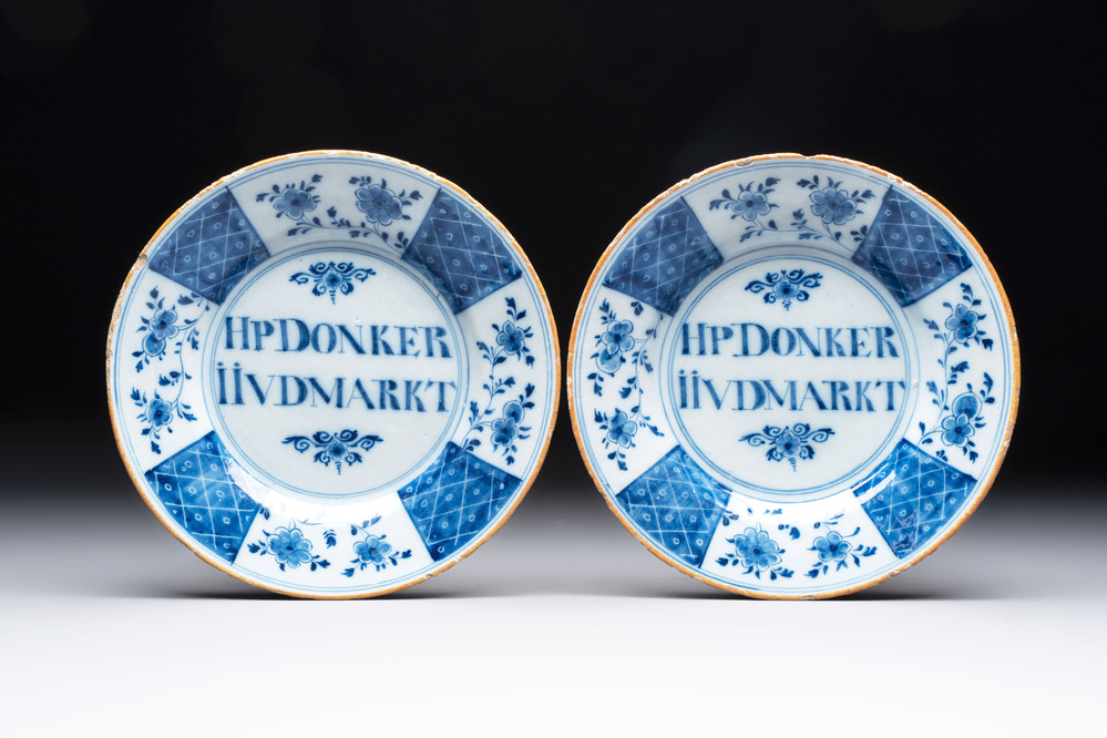 A pair of blue and white Dutch Delft inscribed plates, 18th C.