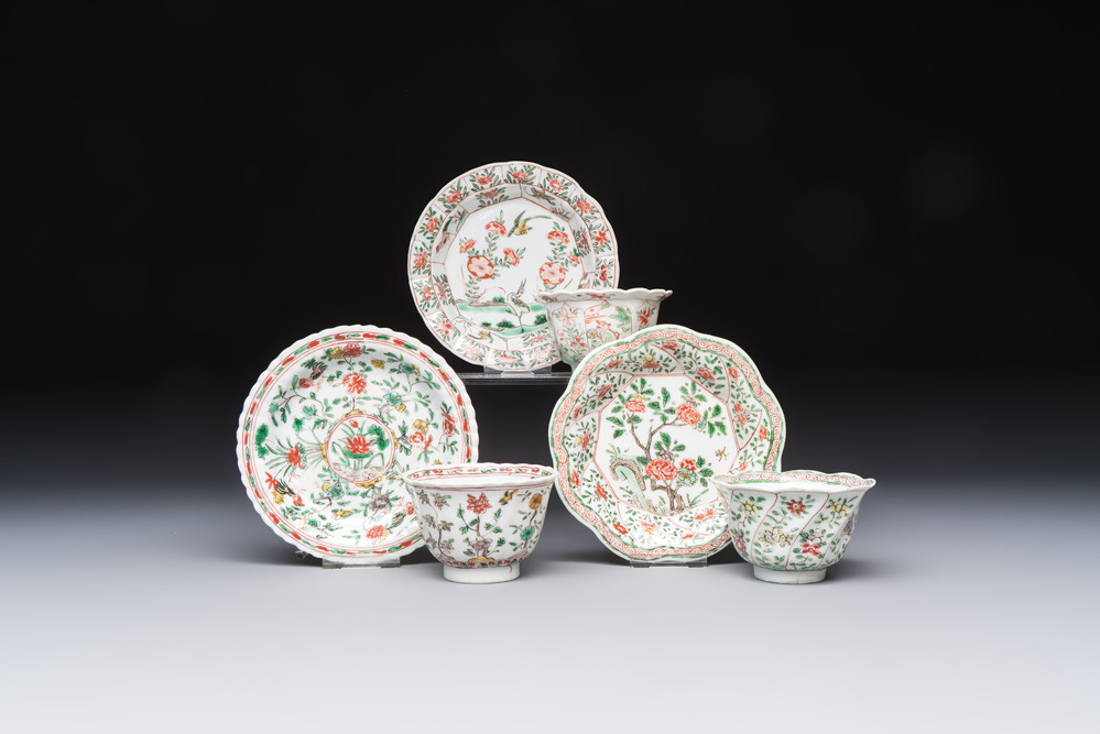 Three sets of Chinese famille verte cups and saucers with birds and flowers, various marks, Kangxi