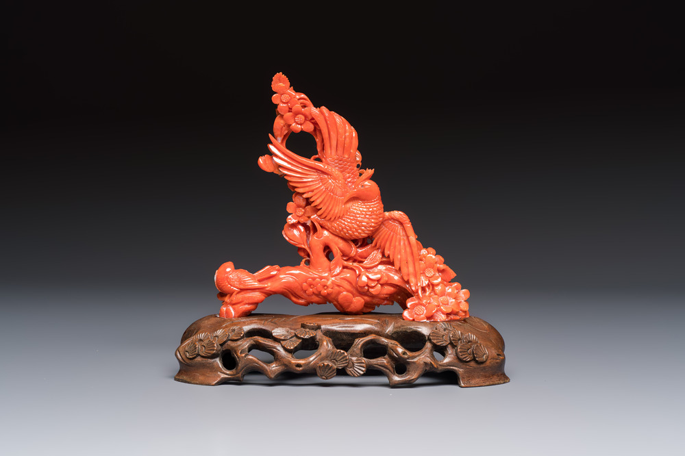 A Chinese carved red coral 'Birds and Flowers' group on a wooden stand, 19/20th C.