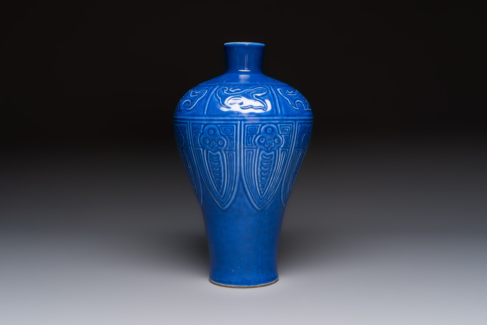 A Chinese archaistic blue-glazed vase with relief design, 20th C.