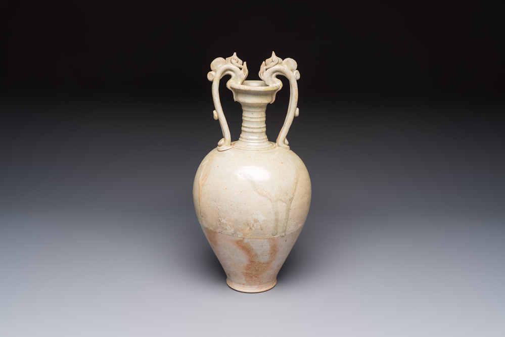 A Chinese straw-glazed pottery amphora with double dragon-shaped handles, Tang