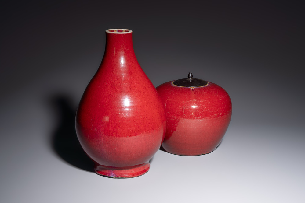 A Chinese flamb&eacute;-glazed vase and a jar with wooden cover, 19th C.