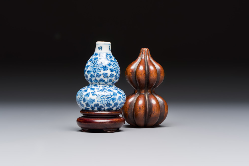 A Chinese blue and white double-gourd snuff bottle and a huali snuff bottle, Xuande and Qianlong mark, 19th C.