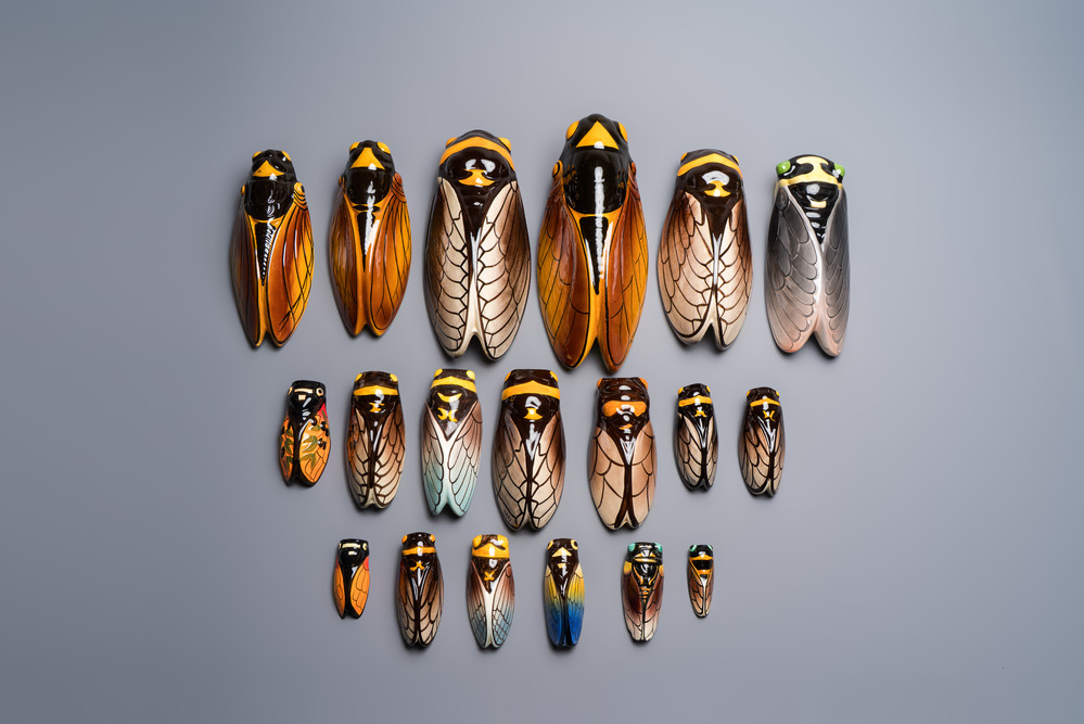 A collection of 19 French &lsquo;Cicada&rsquo; wall pocket vases, 20th C.