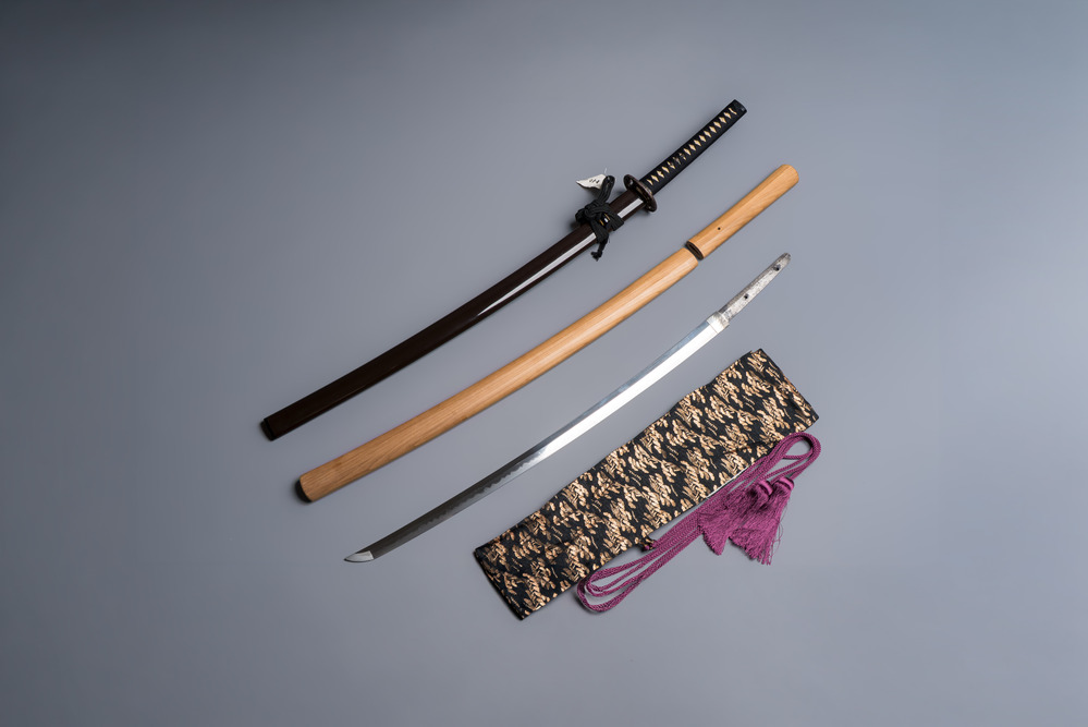 A Japanese katana, signed Ishidō Teruhide saku, with koshirae and shirasaya, Shōwa, 20th C.