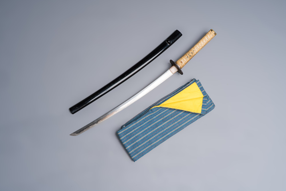 A Japanese katana, signed Yamashiro no Kami Fujiwara Kunikiyo, inscribed 'forged from Nanban tetsu' and chrysanthemum crest, with koshirae, ca. 1629-1665