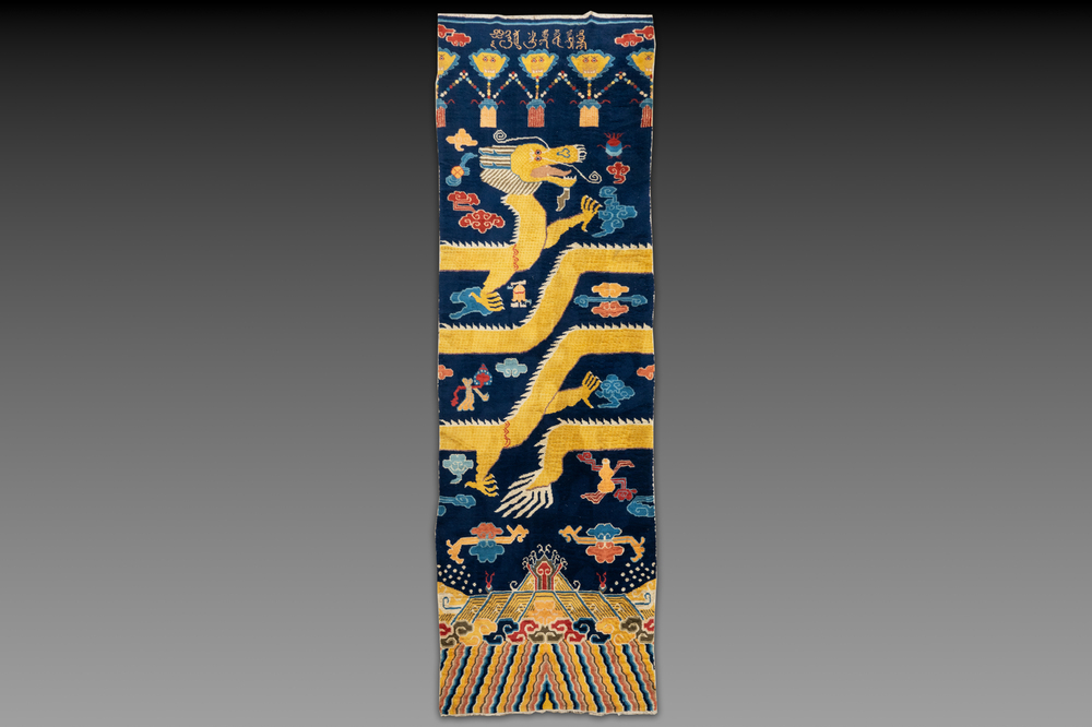 A Sino-Tibetan inscribed woollen 'Dragon' pillar carpet, 19th C.