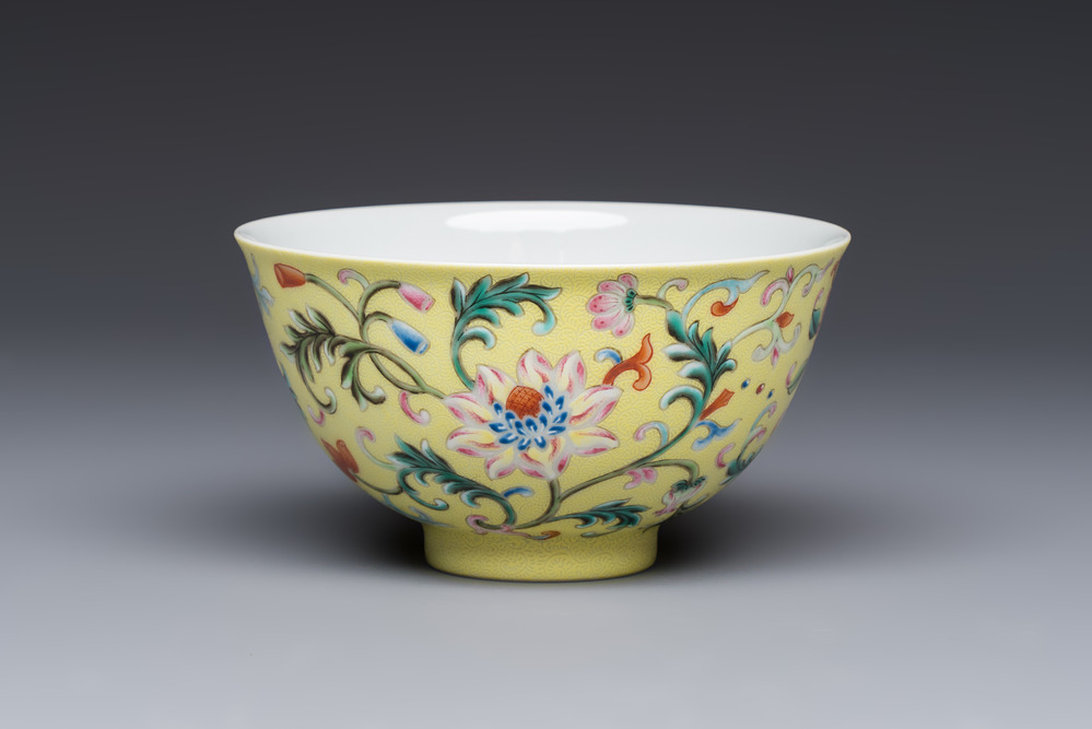A Chinese famille rose sgraffito lemon-yellow-ground 'Flower Scrolls' bowl, Qianlong mark, 20th C.