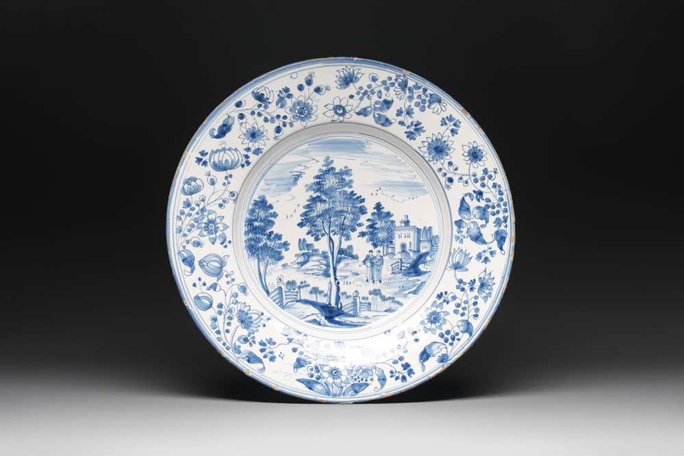 A large blue and white 'landscape and figures' dish, Frankfurt, 17th C.