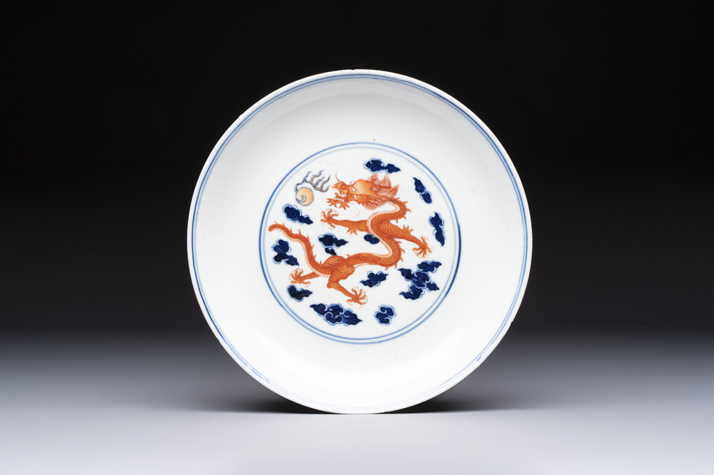 A Chinese blue and white iron-red-decorated 'Dragon' plate, Jing Jin Tang 精進堂 mark, 19th C.