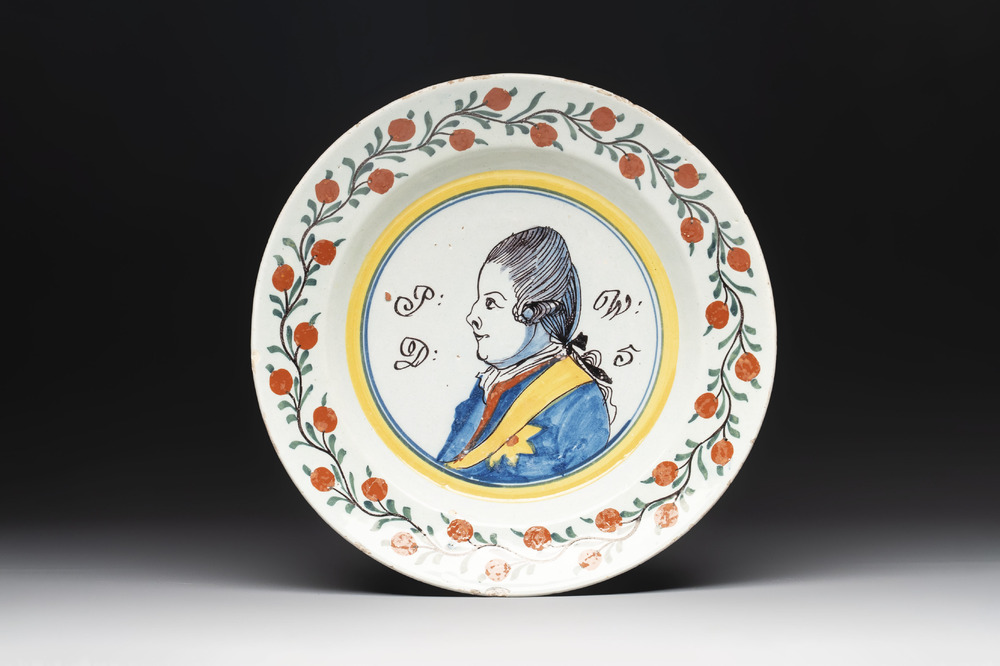 A polychrome Dutch Delft 'orangist' 'royal portrait' plate, 18th C.
