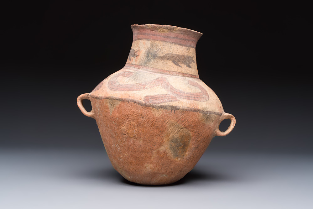 A Chinese painted pottery jar with handles, Late Bronze Age, Xindian culture, 13/10th C. B.C.