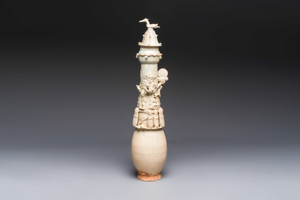 A large Chinese qingbai covered urn applied with immortals and a dragon, Northern Song