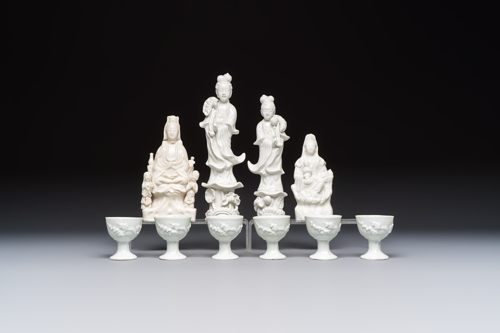 Four Chinese Dehua blanc de Chine figures of Guanyin and six wine cups, Kangxi and later